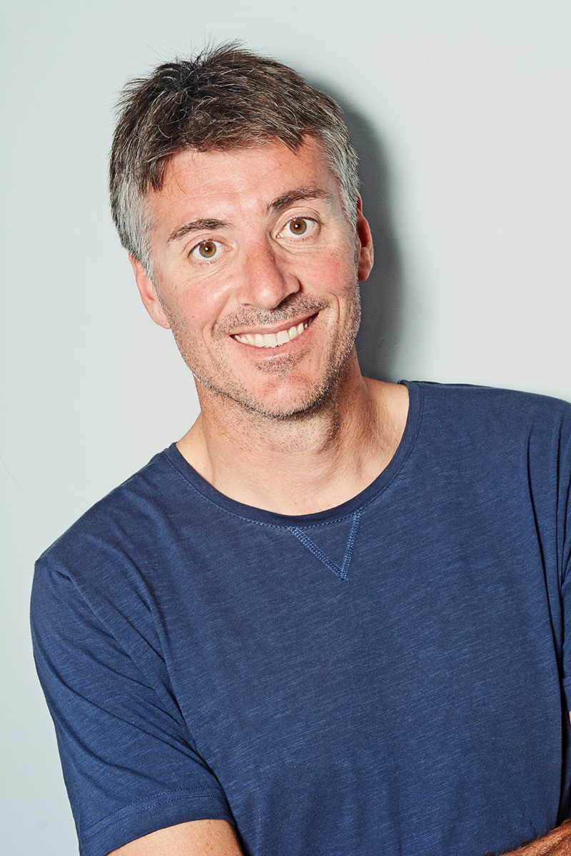 Author photo: Gregg Dunnett, in a blue t-shirt, against a pale background.