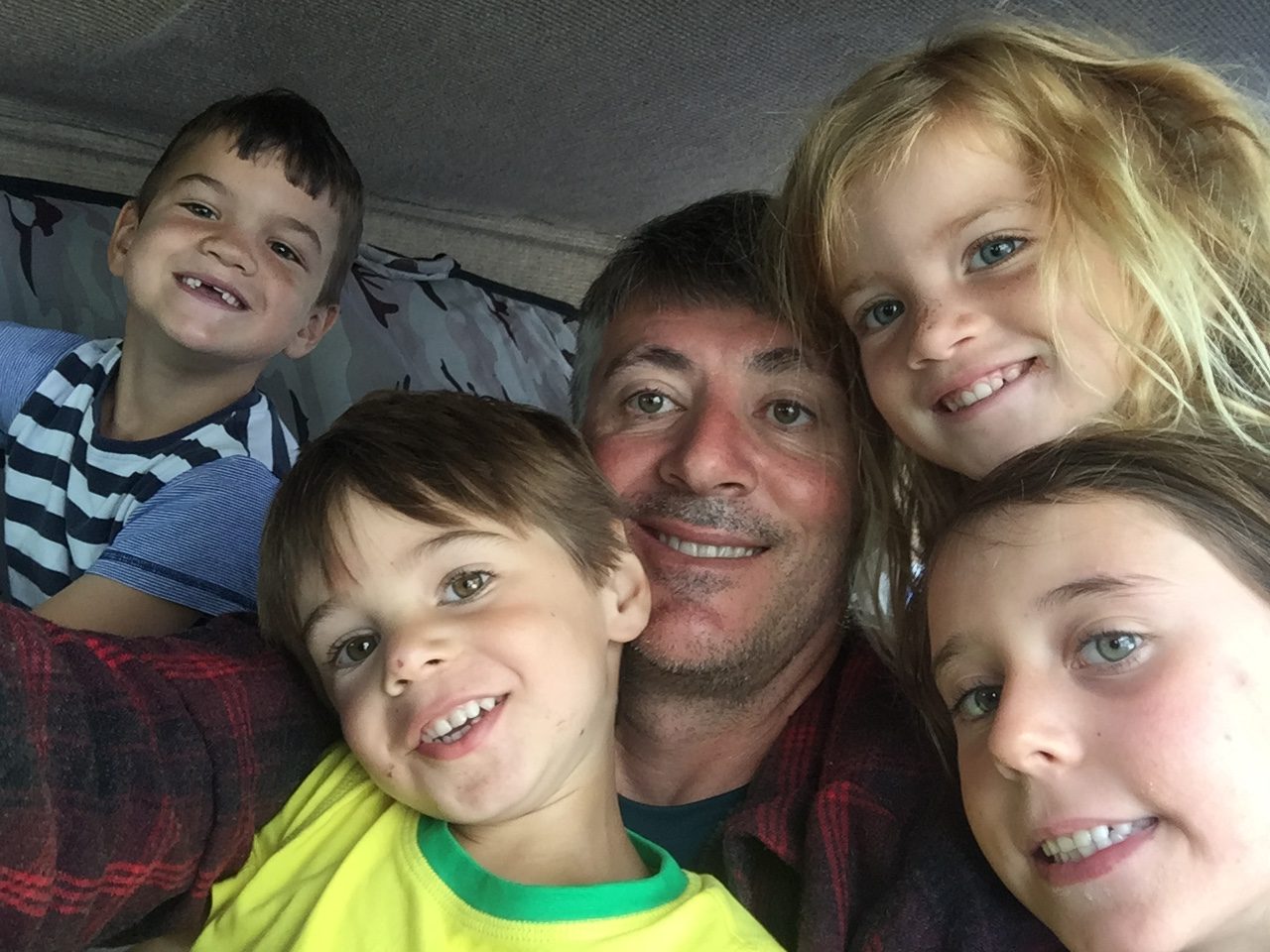 Gregg and his four children squashed into a tent at the French campsite, grinning post-read-through.