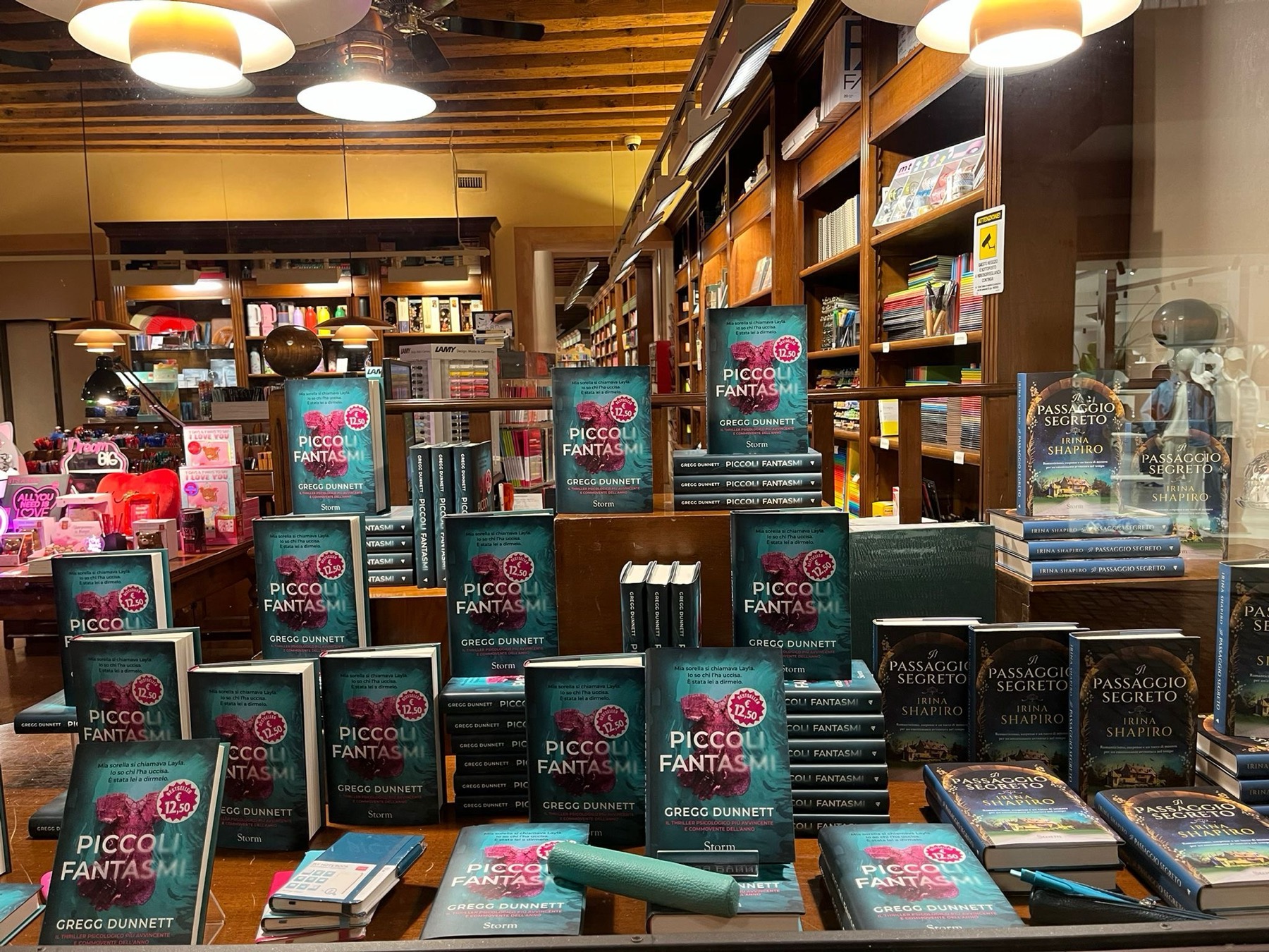 A bookshop window in Genoa, Italy, stacked with copies of Piccoli Fantasmi — the Italian edition of Gregg Dunnett's Little Ghosts.